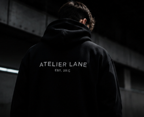 Black Atelier Lane hoodie back print with EST. 2026